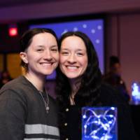 Two grads smile at Toast